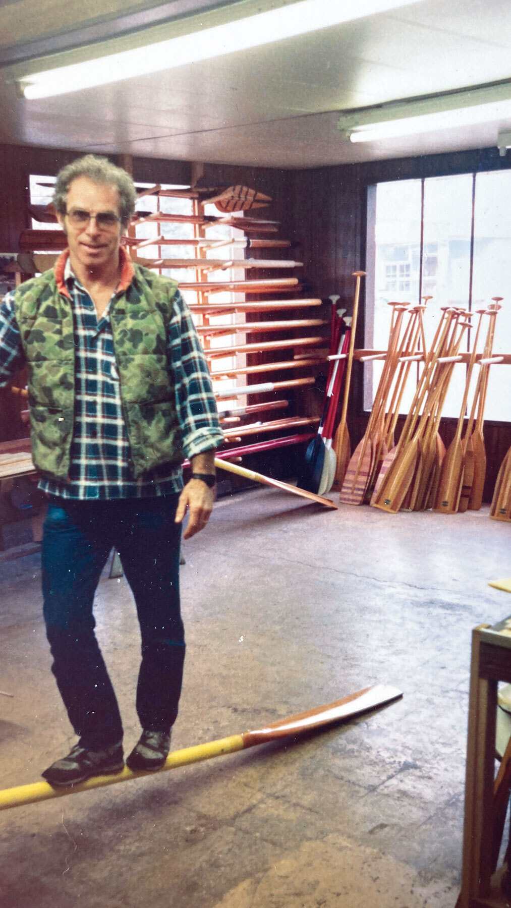 Ralph Sawyer standing on an oar to demonstrate its strength